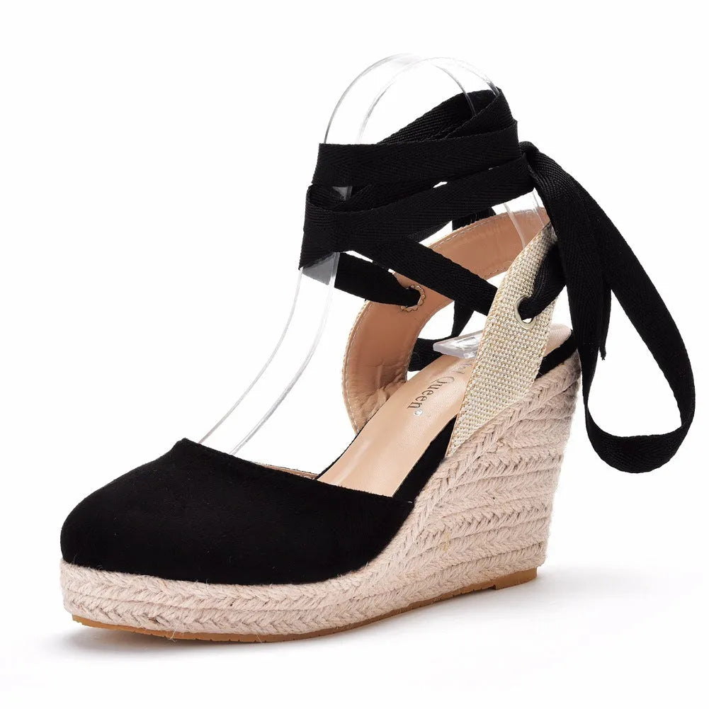 Women's red bohemian wedge sandals with buckle strap, tassel detail, and a fish mouth toe.