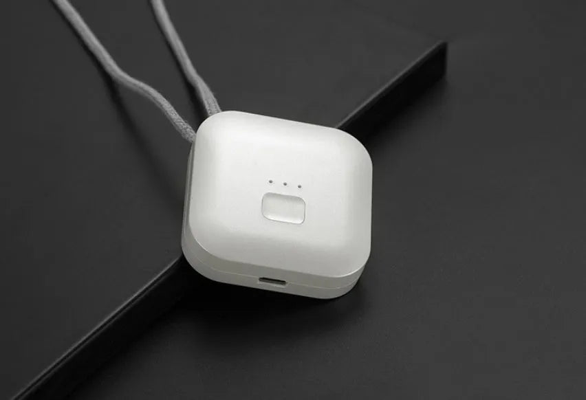 Mini USB portable air purifier necklace in pink, showing compact design with a wearable collar.