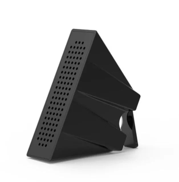 A small, coloured ABS plastic phone amplifier holder on a desktop, holding a mobile phone horizontally.