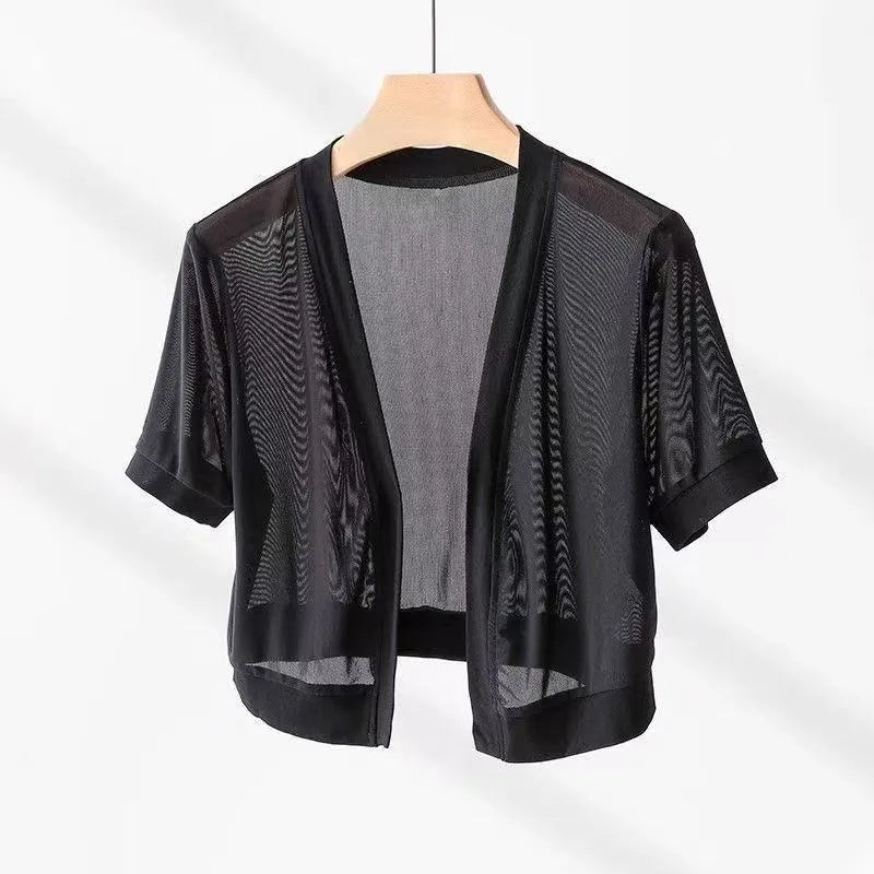 Women's black French-style tied shirt with an irregular collar and long bell sleeves.
