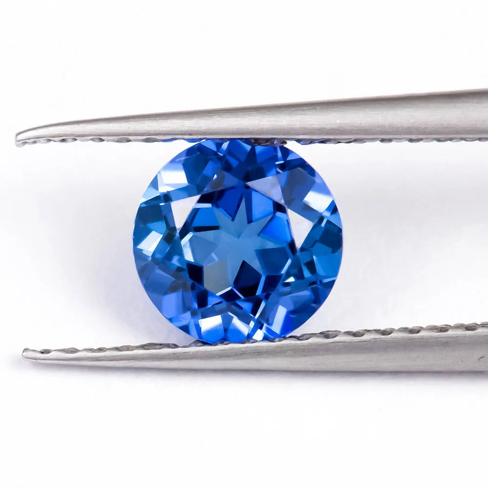 Royal blue love shaped tiara gemstones in various weights and shapes including heart, round, and pear styles