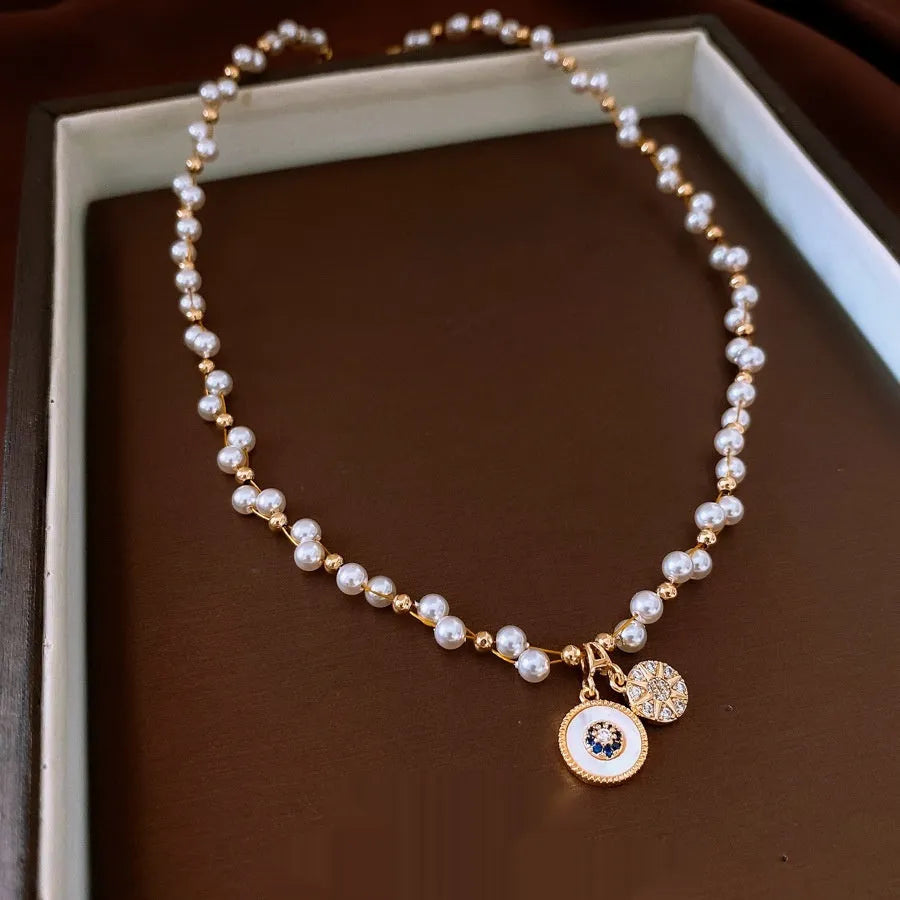 Gold electroplated zircon and imitation pearl pendant necklace with adjustable clavicle chain