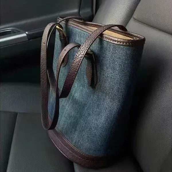 Denim patchwork one-shoulder bucket handbag with polyester construction measuring 23cm by 27cm by 16cm