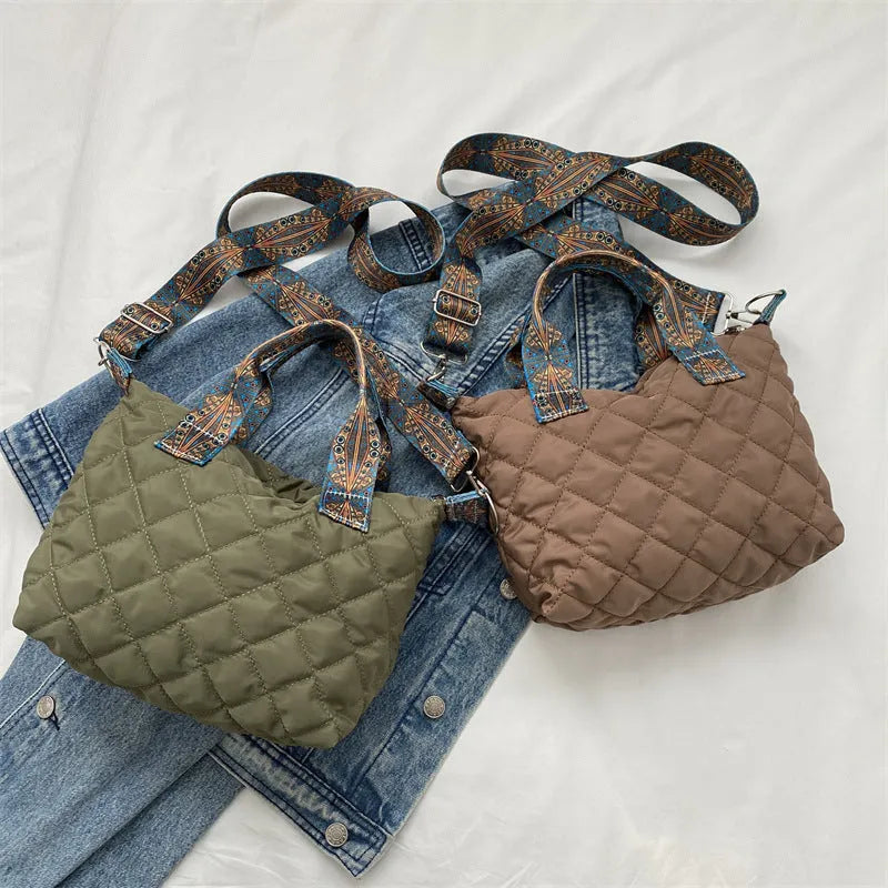 Soft horizontal square Oxford cloth shoulder messenger bag in green with embroidery detail and a single strap.