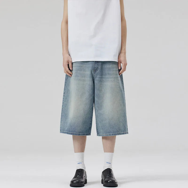 Men's straight-leg cotton denim shorts in cropped length on a casual model