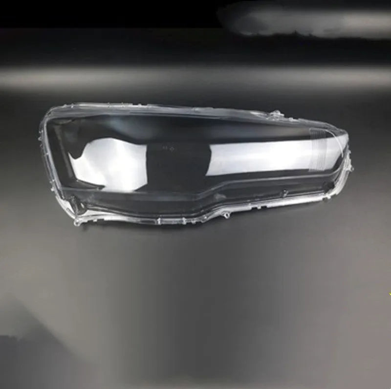 Transparent plastic vehicle headlight housing cover showing dimensions.