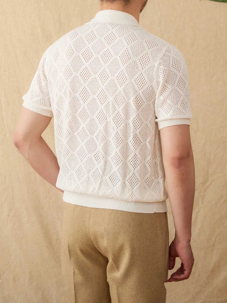 Light brown short sleeve zip-up cardigan with a lapel collar laid flat.