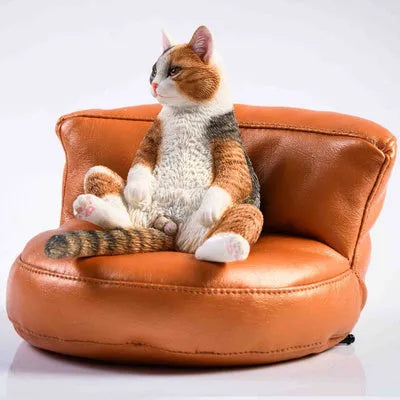 Lazy cat ornament and fabric sofa model set for car dashboard, 7.5cm high.