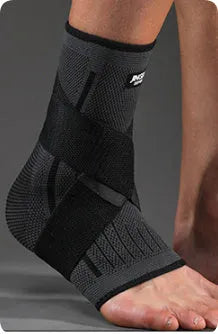 Black sports ankle support strap with Velcro fastener, shown unwrapped.