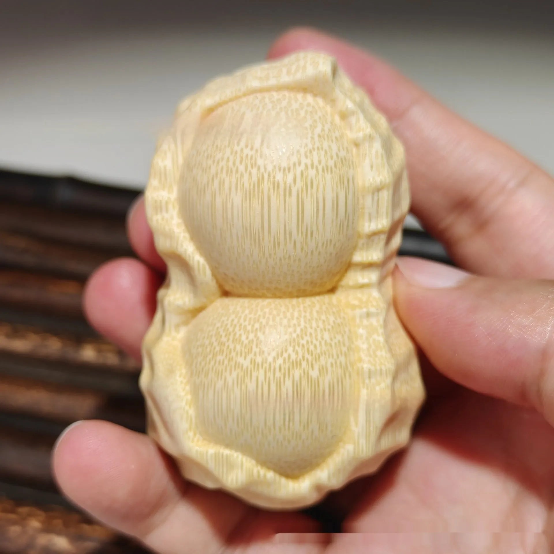 Solid bamboo carving peanut ornament with natural finish and modern simplicity design