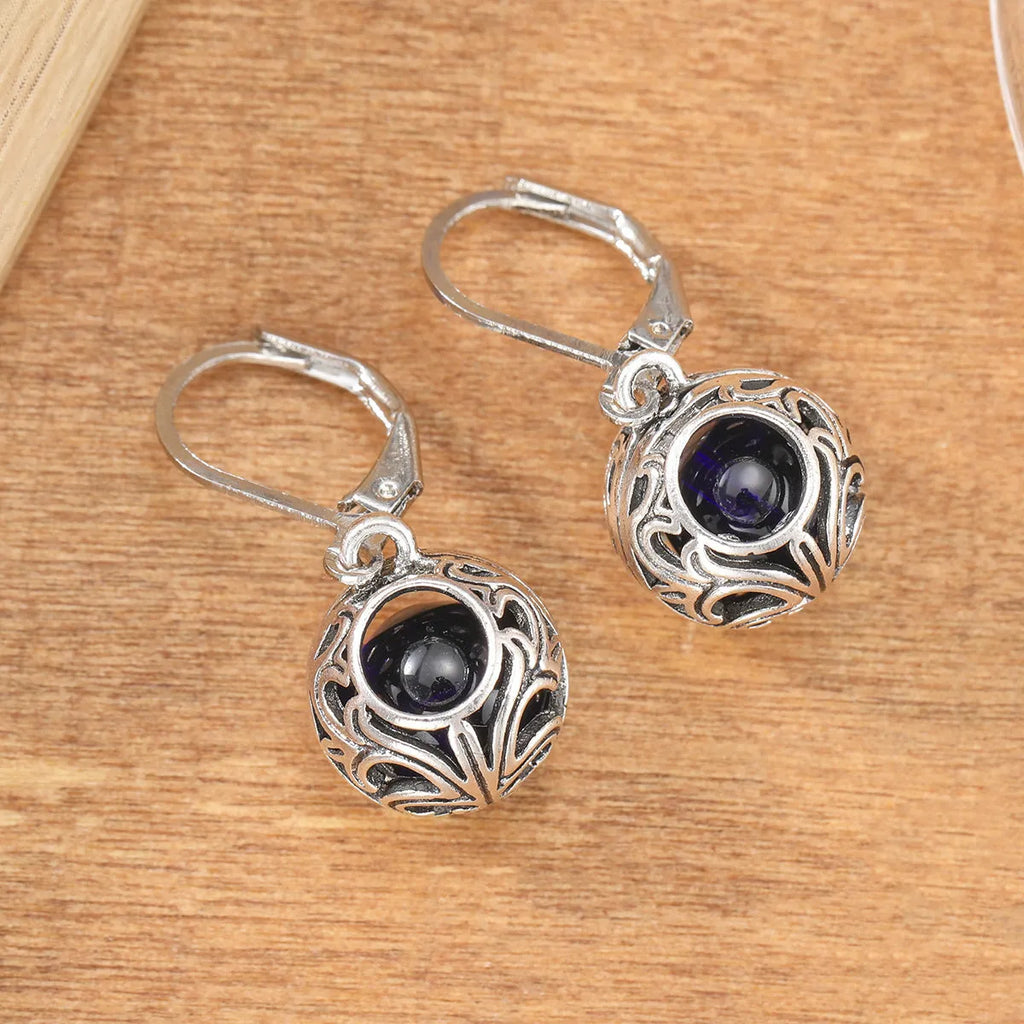 Vintage geometric blue gemstone pendant earrings with hollow engraving detail in silver-tone zinc alloy