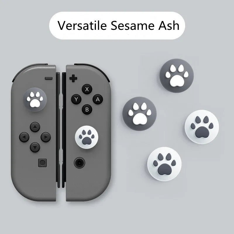 Four silicone rocker caps for Nintendo Switch Joy-Con controllers in assorted colours on a grey background.