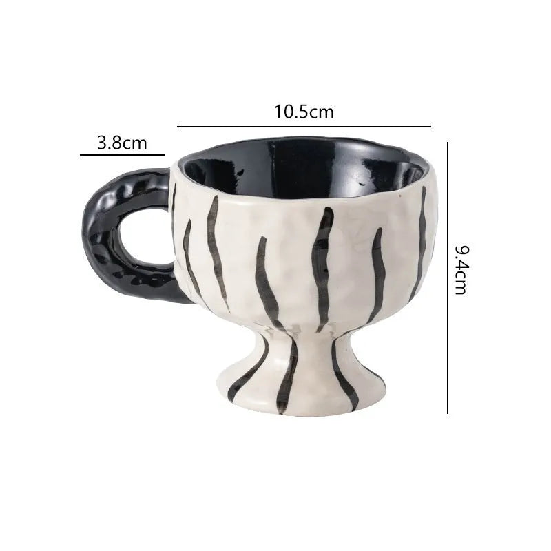 Handmade ceramic mug with irregular shape in solid colour