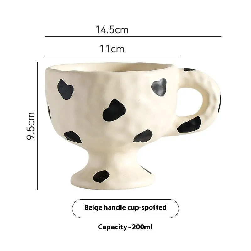 Handmade ceramic mug with irregular shape in solid colour