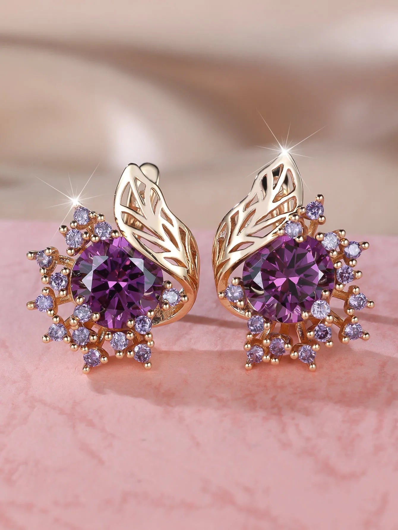 Round floral earrings with feather detailing and coloured zircon stones in champagne gold finish