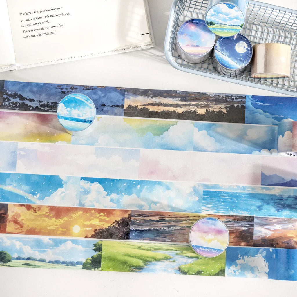 Japanese paper washi tape roll with sky theme designs including clouds, sun and nebula patterns