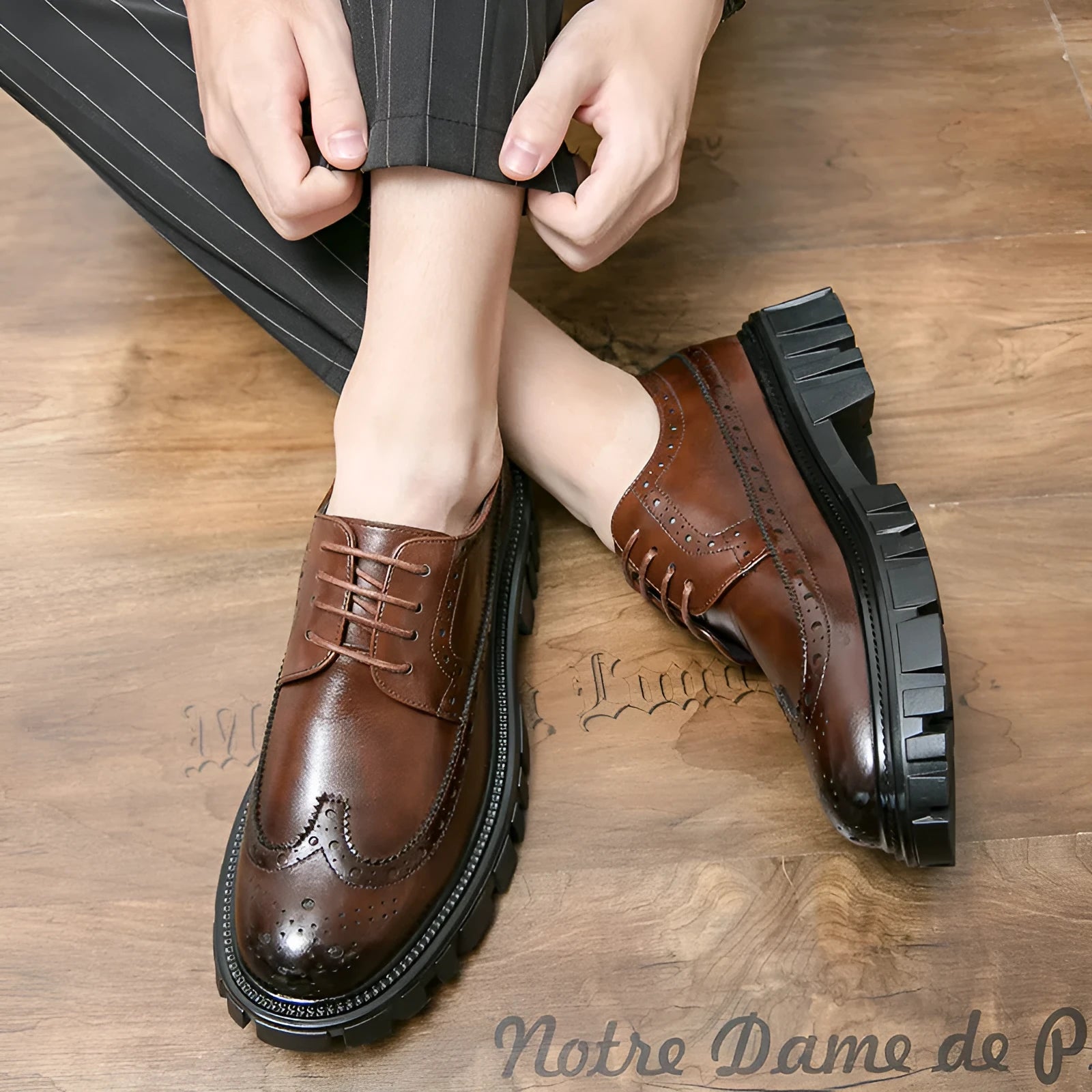 Men's black and brown brogue Oxford shoes with wingtip detailing and round toe