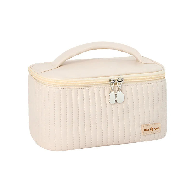 Open-top cake-shaped makeup bag in PU leather, shown in a solid colour from the pink, coffee, beige, blue, green, purple range.