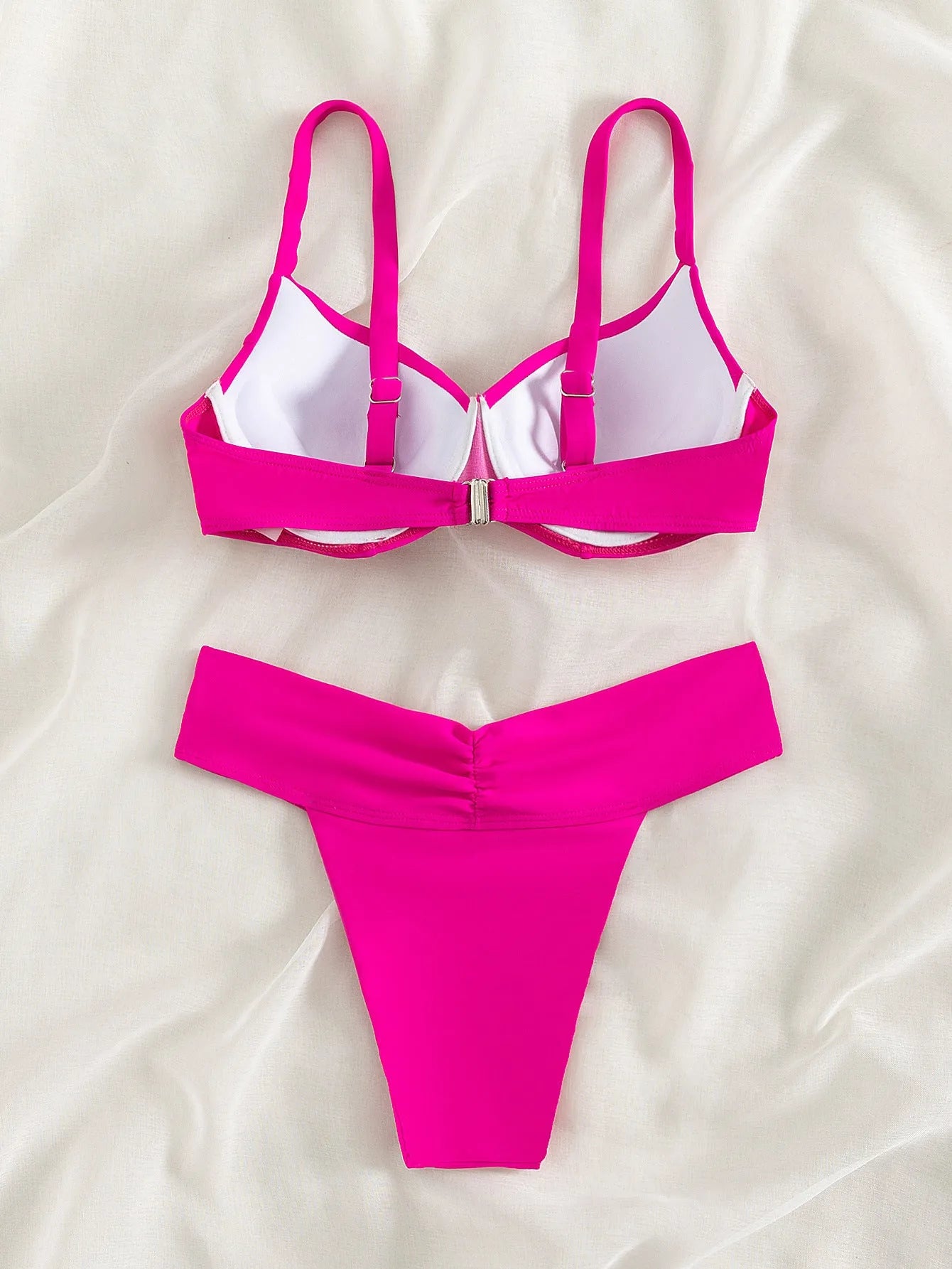Fluorescent colour bikini swimsuit set with bra and briefs on a white background.