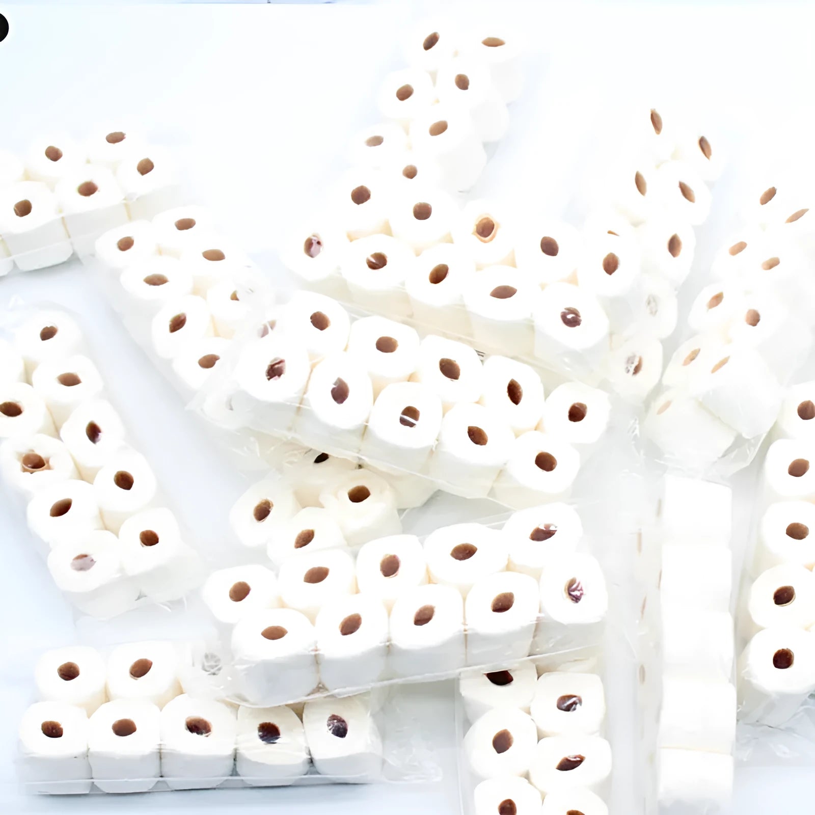 Small paper model of a tissue roll for dollhouse play, measuring 30mm by 15mm by 80mm.