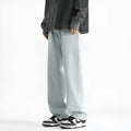 Men's light blue washed straight leg jeans with a button waist on a mannequin