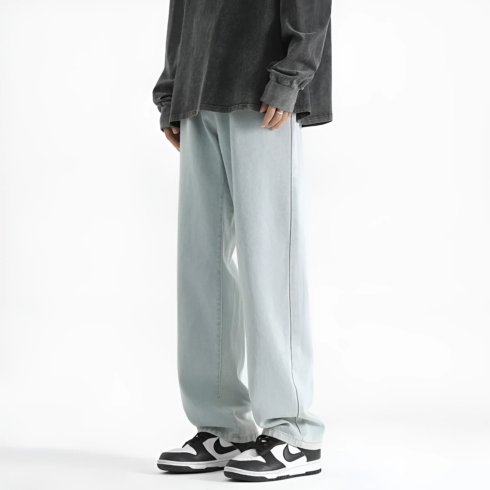 Men's light blue washed straight leg jeans with a button waist on a mannequin