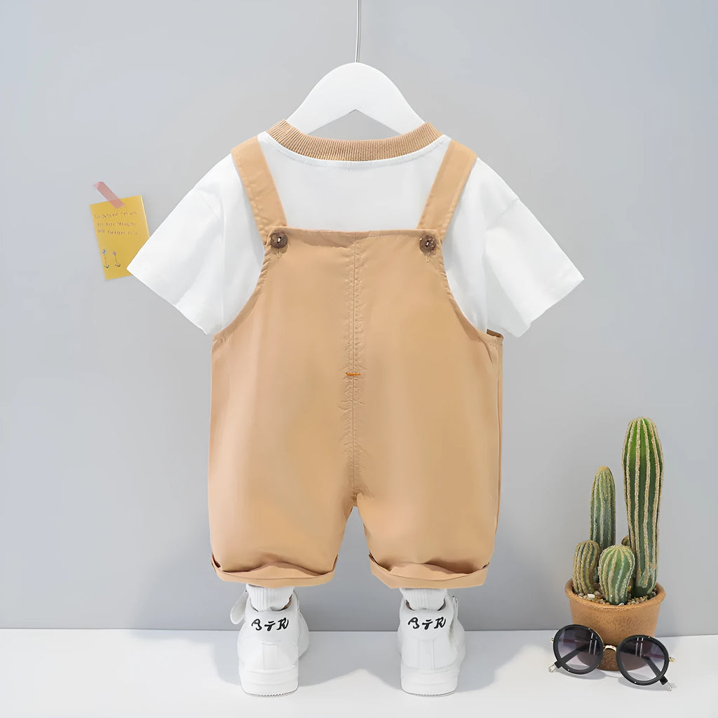 A yellow cotton baby overalls with a cartoon print, featuring short sleeves and openable straps.