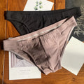 Men's pure cotton triangle underwear briefs in solid colours like black, white, and apricot on a mid-waist fit model.