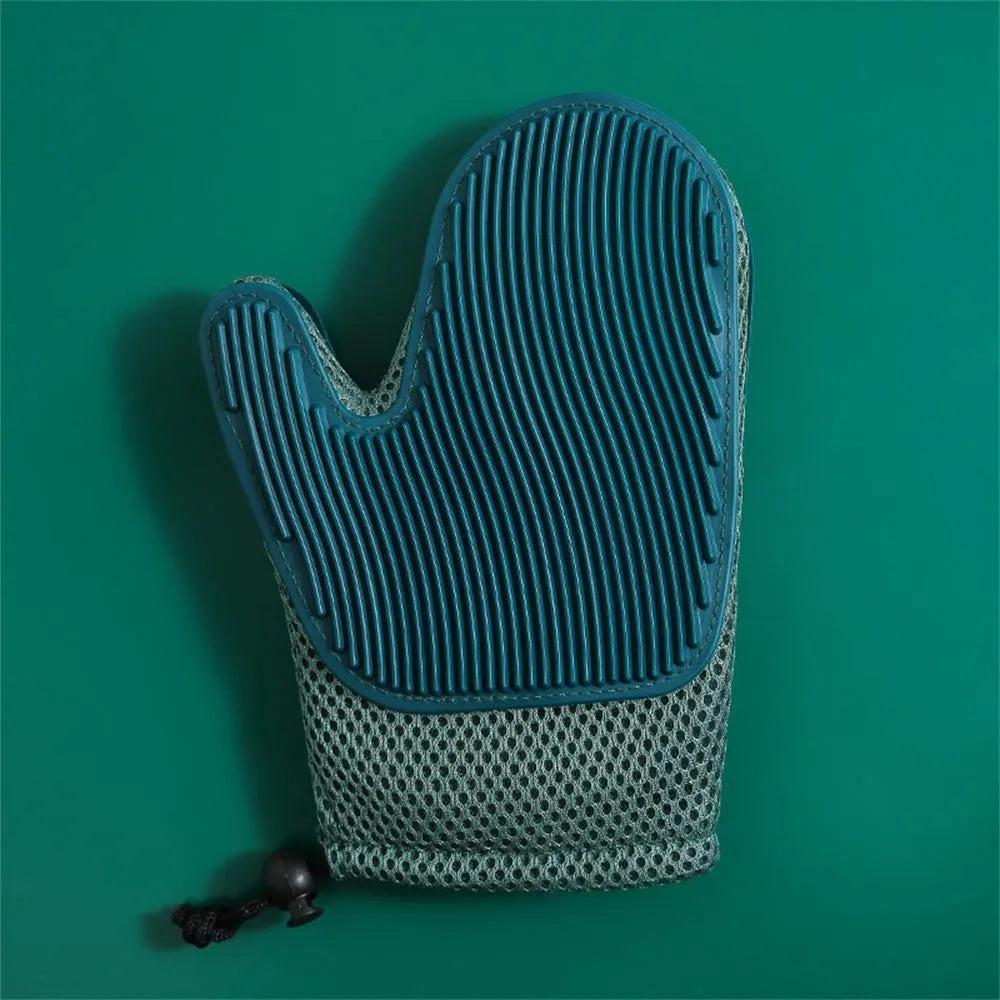 Dark blue mesh and TPR pet grooming glove for removing dog and cat hair from fur and fabrics.