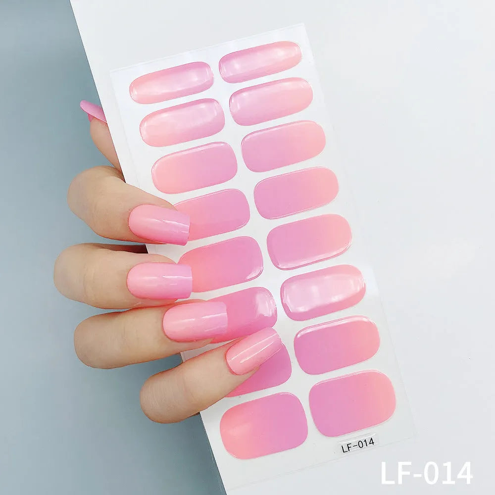 Set of 16 solid colour nail art stickers showing floral, geometric, and pattern designs for manicure application
