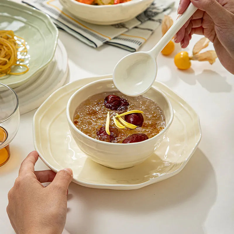 Seven-piece solid colour ceramic dinner plate and bowl set in boxed packaging.