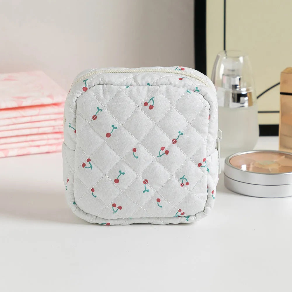 Breathable polyester key storage bag showing multiple floral and cherry pattern options including white background designs