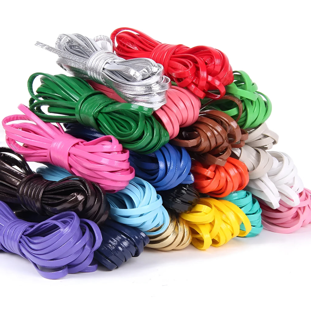 Coils of PU leather craft cord in multiple colours including black, red, blue, and beige