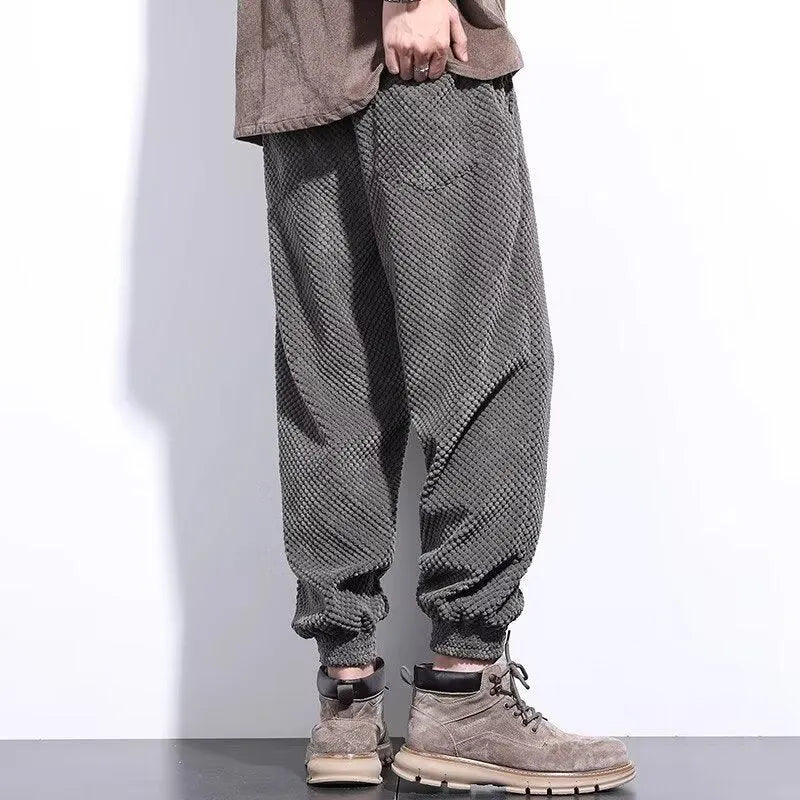 Men's grey ankle strap sweatpants with straight leg cut on mannequin