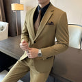 Men's slim fit business formal jacket and trousers in a dark green chemical fibre blend fabric.