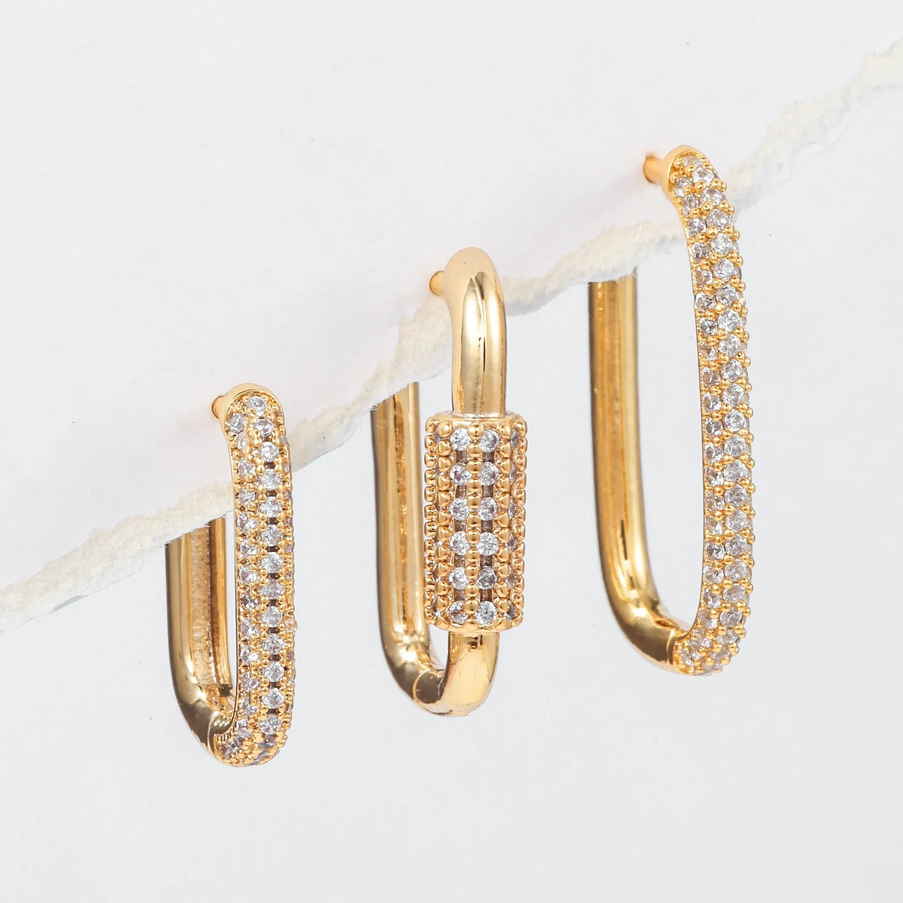 Three geometric zircon ear clips with square design in gold and white colour options