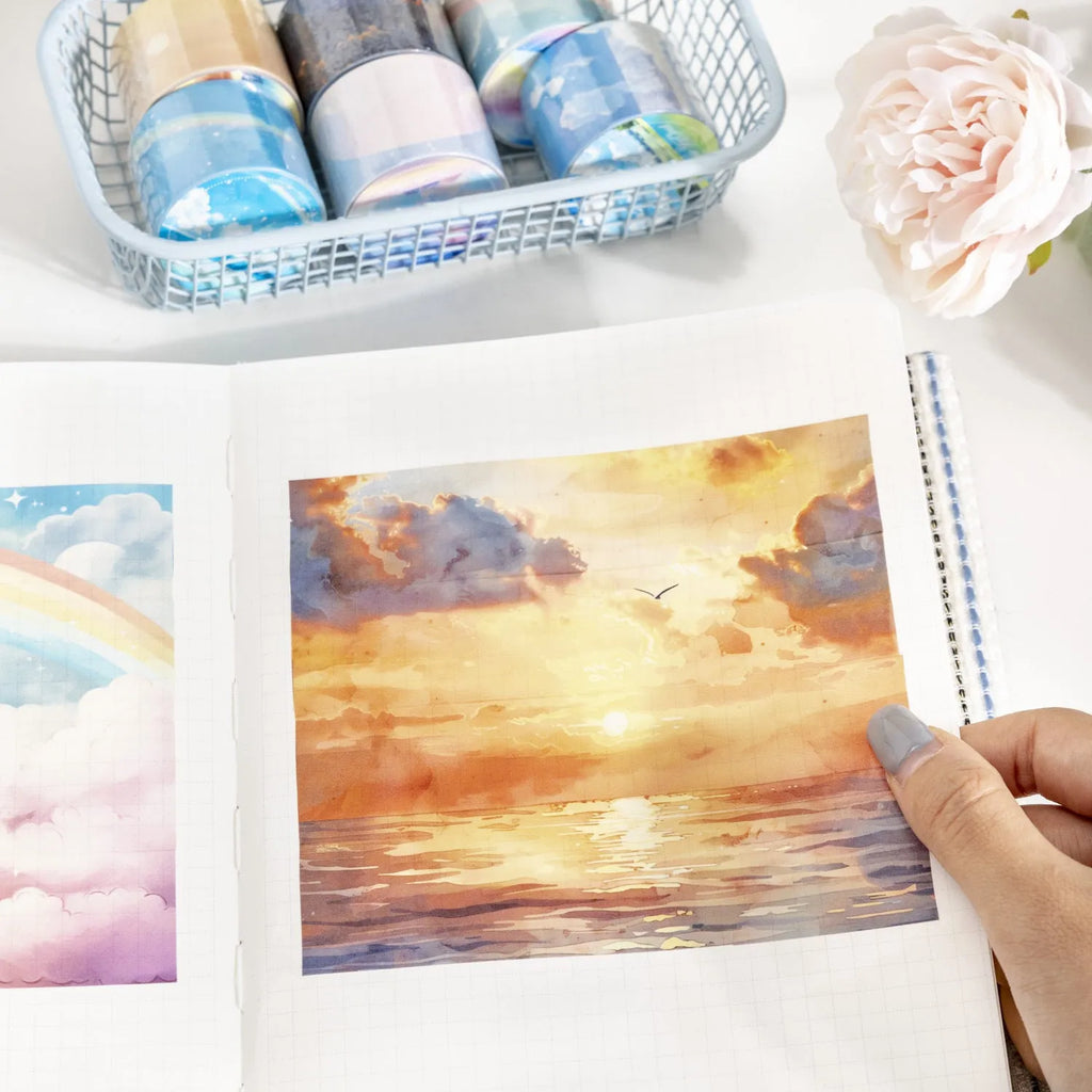 Japanese paper washi tape roll with sky theme designs including clouds, sun and nebula patterns