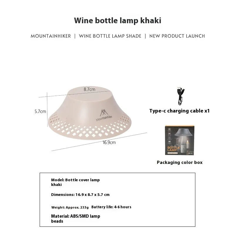 Beige wine bottle shaped rechargeable camping lantern with LED light on a wooden surface.