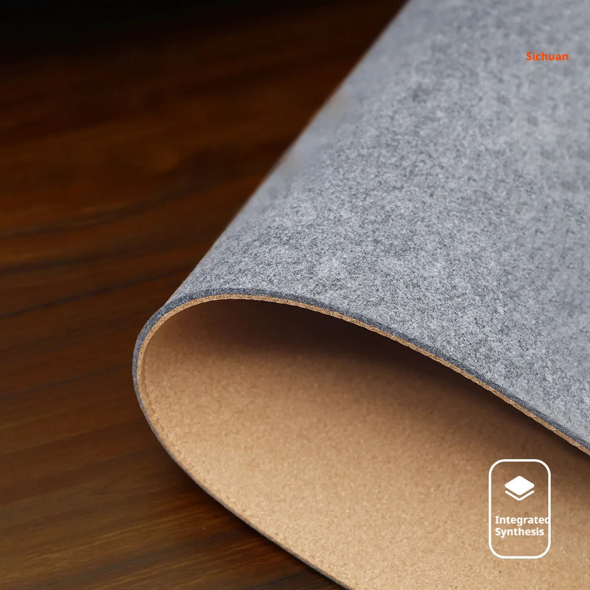 Oversized grey felt cork desk mat with non-slip backing shown on office desk