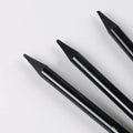 Carbonized Pencil Suit set showing graphite and carbonized pencils with wooden shells on a suction card.