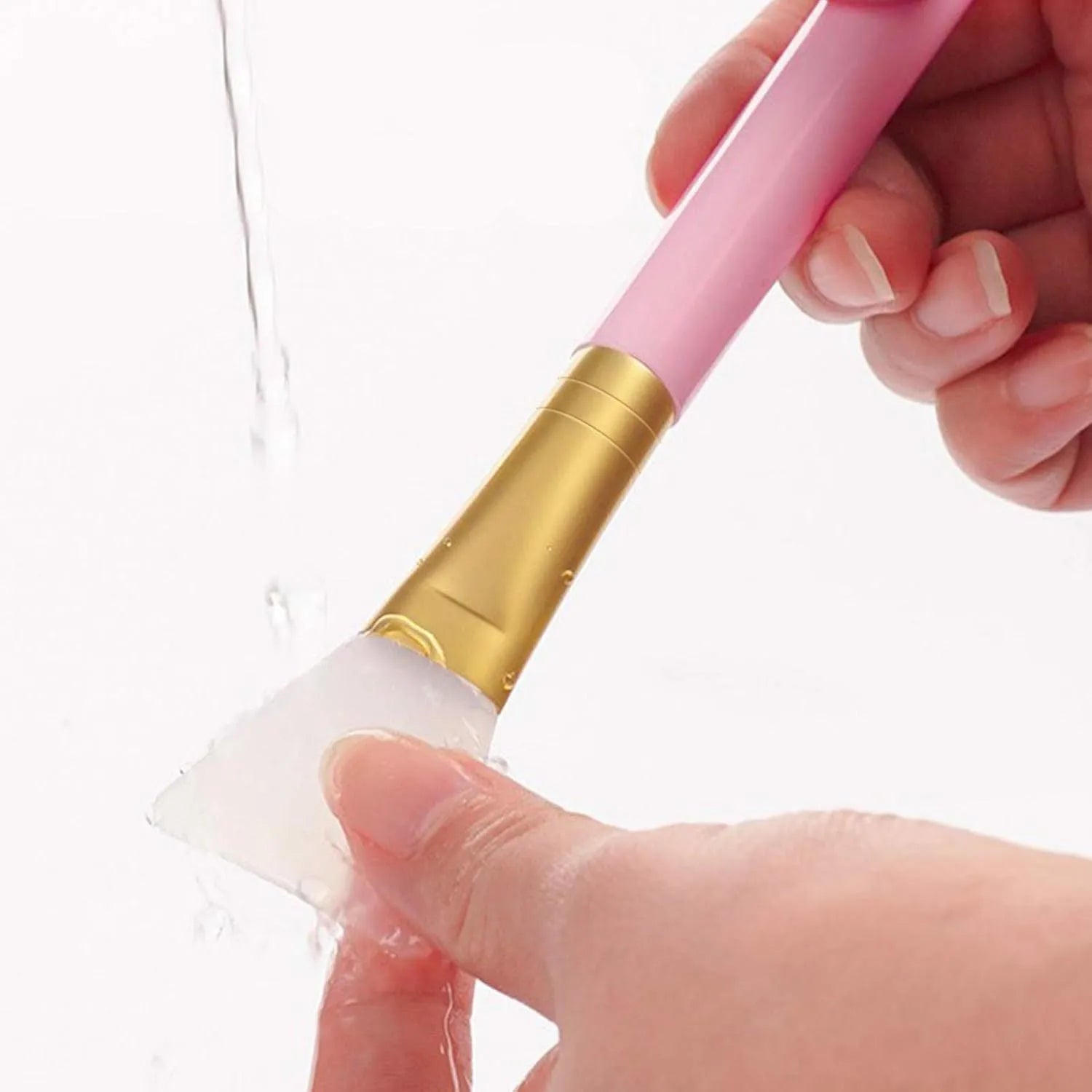 Reusable silicone face and body mask applicator spatula in six colour options.