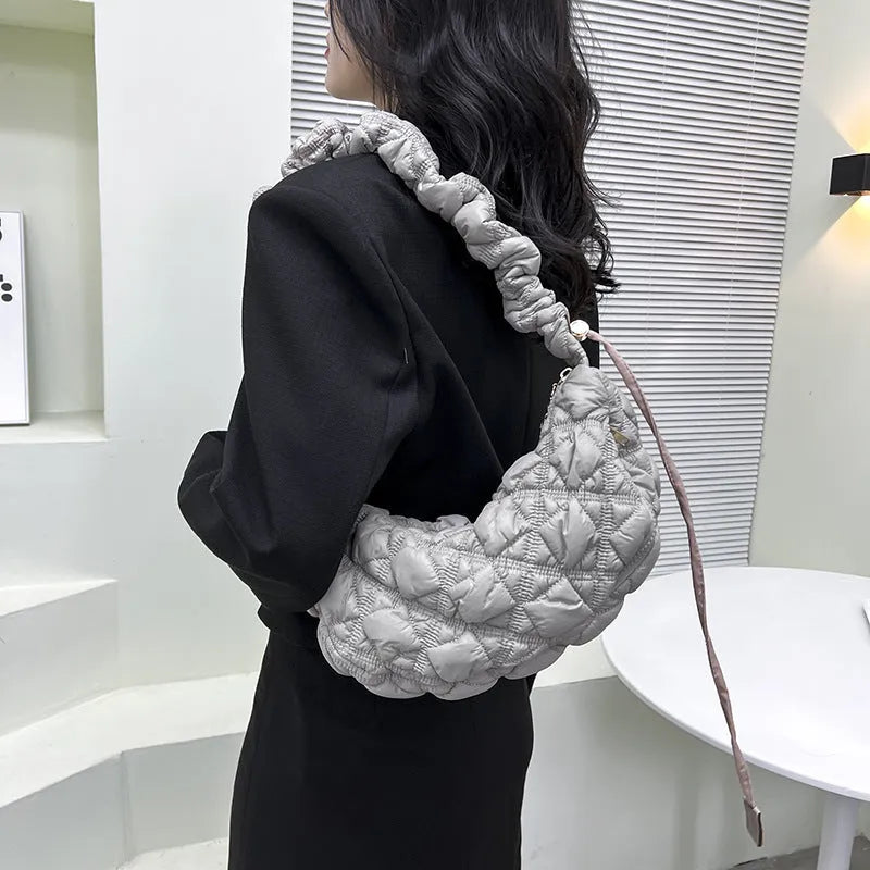 Women's nylon shoulder messenger bag in beige colour showing dimensions and adjustable strap