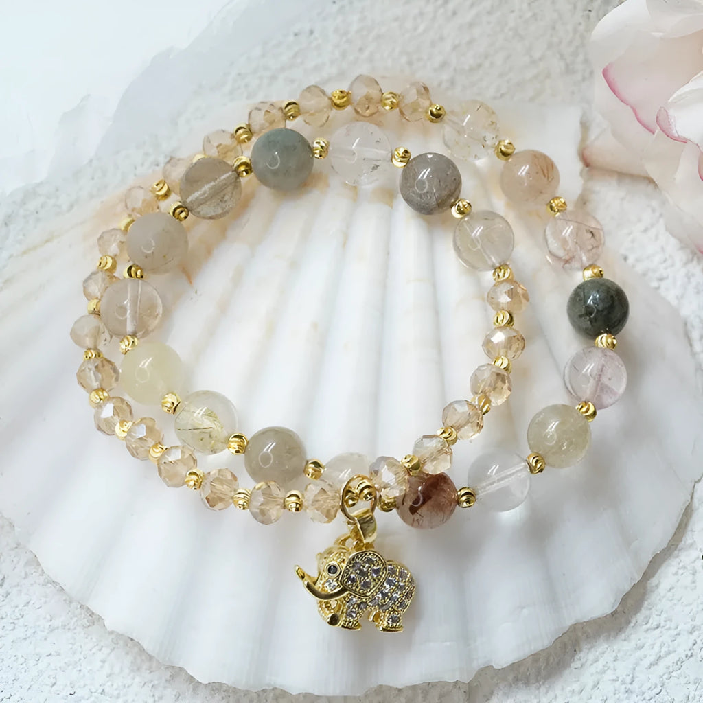 Women's retro bracelet in colour hair crystal or strawberry quartz with ethnic design elements