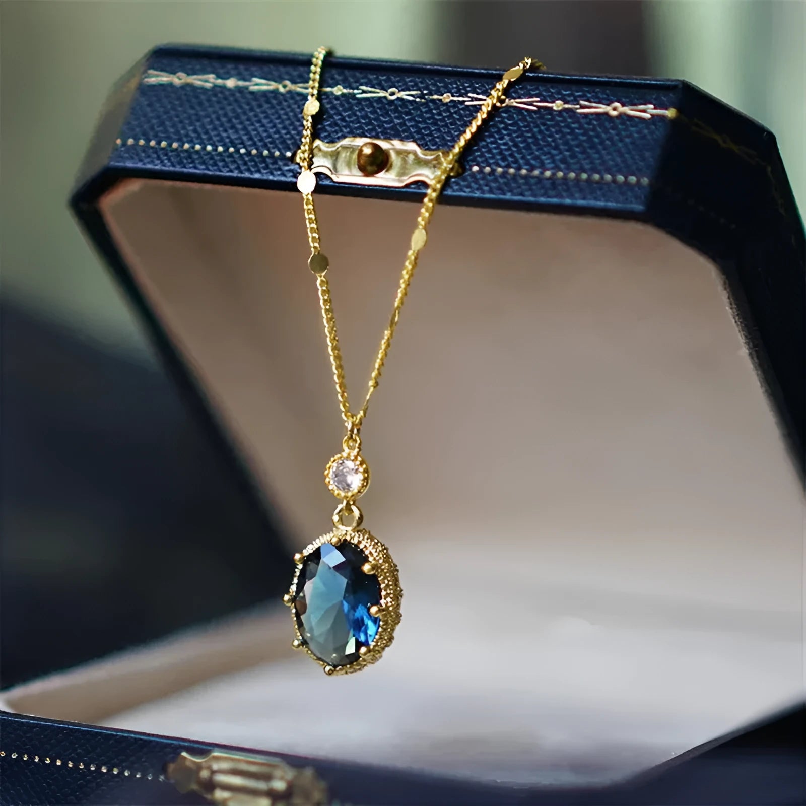 Gold geometric copper pendant on a French retro unisex necklace.