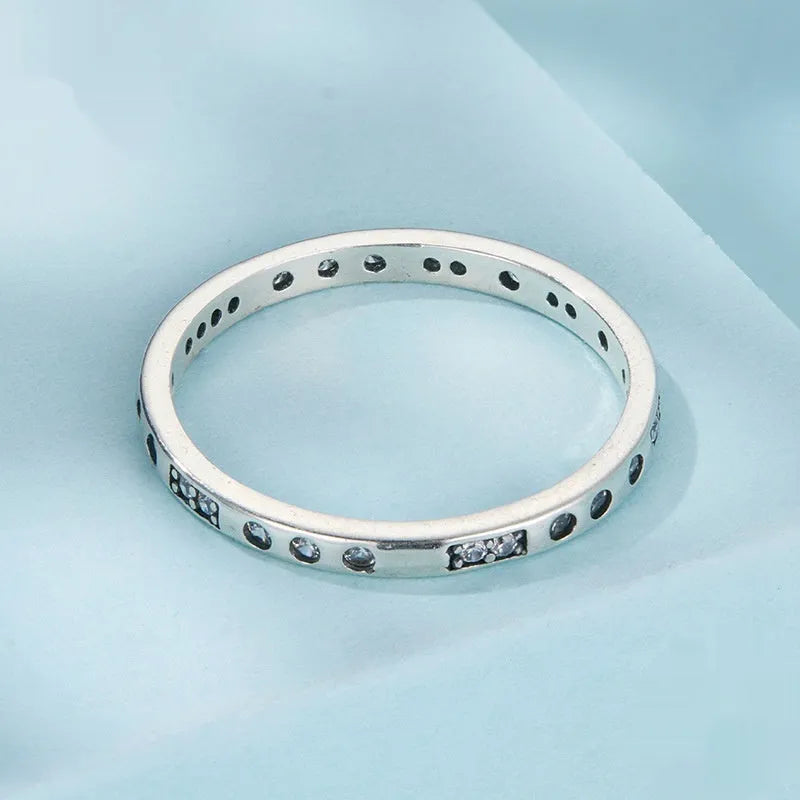 Moss Password black oxidised silver I Love You ring on a jewellery display.