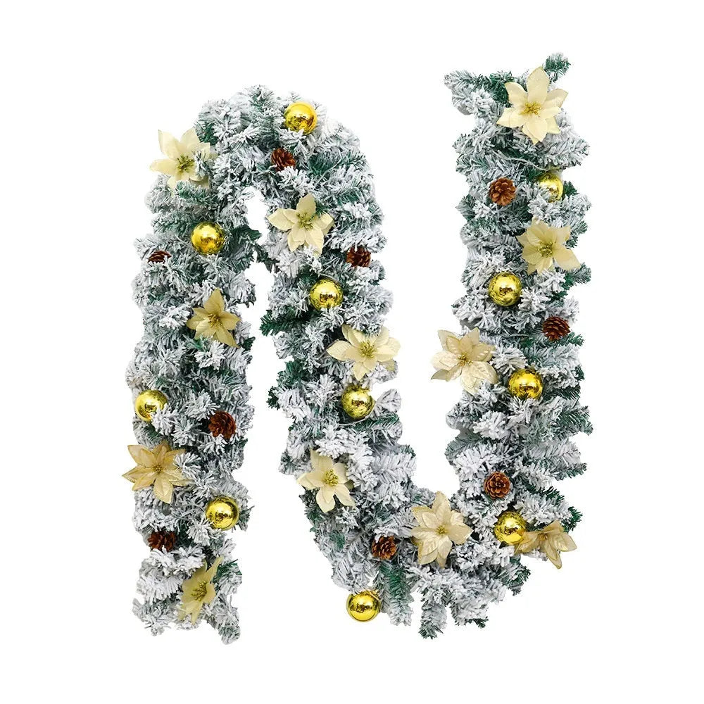 PVC rattan Christmas garland with flocked decoration in golden colour, draped along a mantle