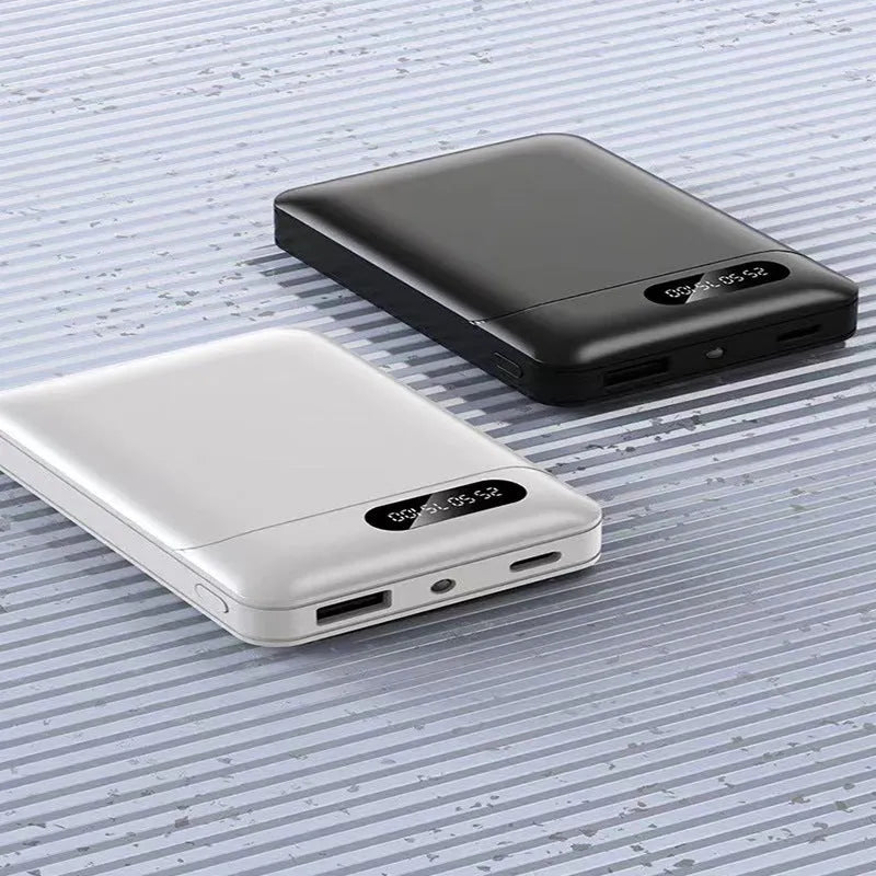 Black and white plastic power bank with USB ports and 10000mAh capacity