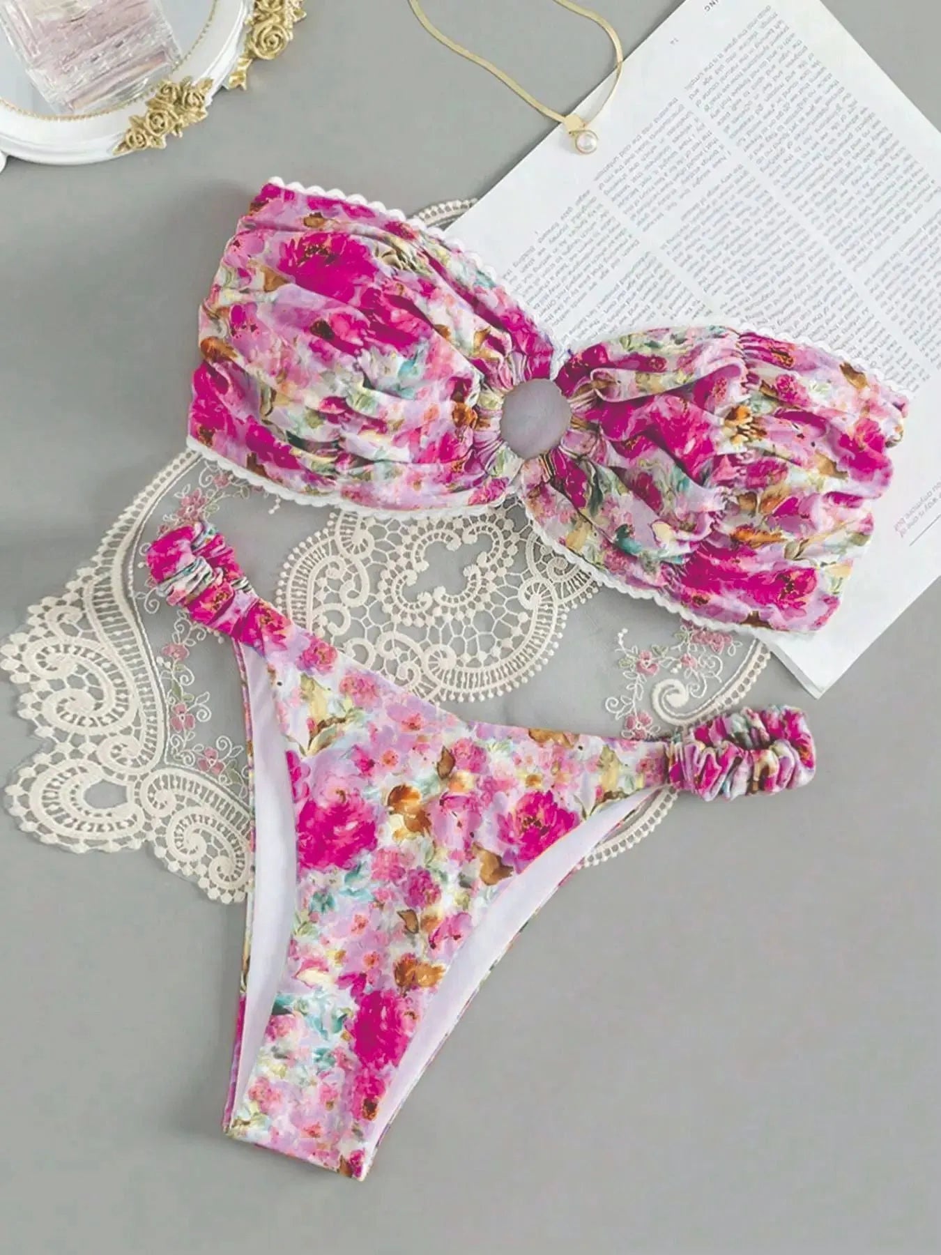 Women's tube top bikini set with lace trim in blue, yellow, pink, and floral print colours.