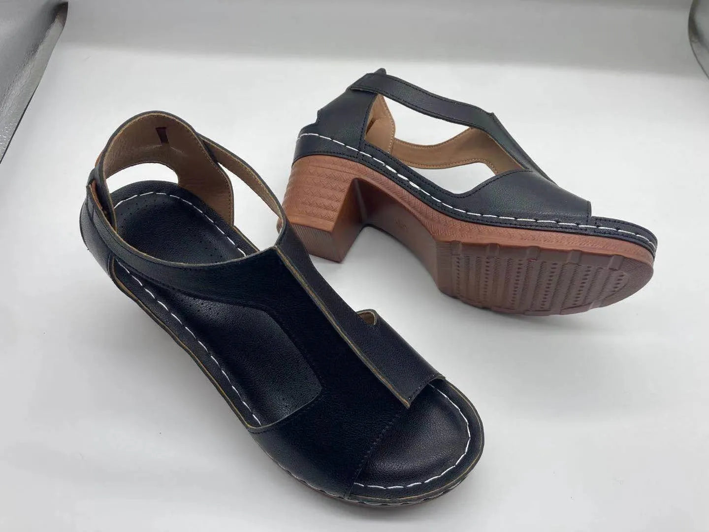 Women's white peep toe wedge sandals with Roman style buckle and low heel