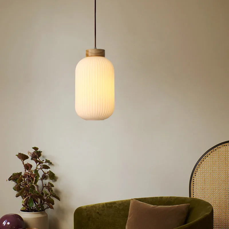 Nordic-style retro wooden pendant ceiling light with a natural wood finish, shown in a bedroom setting.